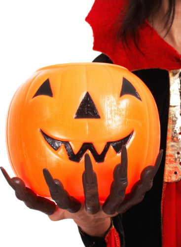 Pumpkin For Trick Or Treat Held By Girl In Vampire Costume